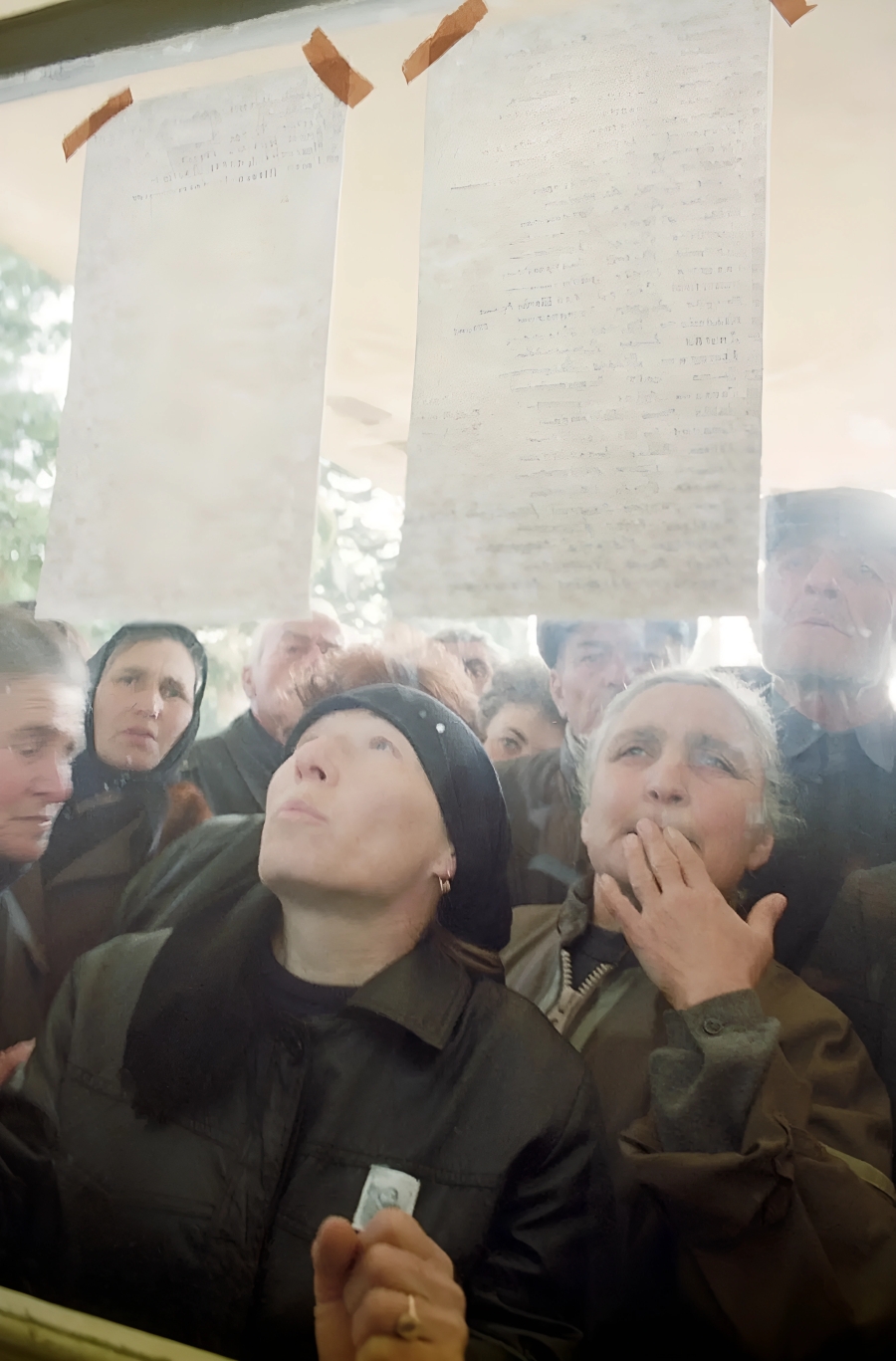 Locals in Sukhum read the list of victims during the 1992-1993 Georgian-Abkhazian war. 9 March 1993