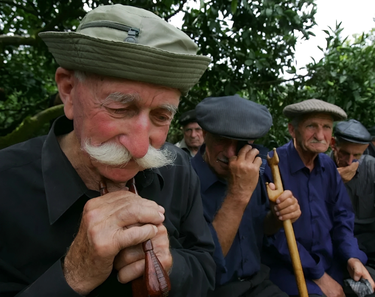Men cry during the funeral of an Abkhaz soldier who was killed in the remote Kodor after an armed clash with Georgians. August 16, 2008. Men cry during the funeral of an Abkhaz soldier who was killed in the remote Kodor after an armed clash with Georgians. August 16, 2008.