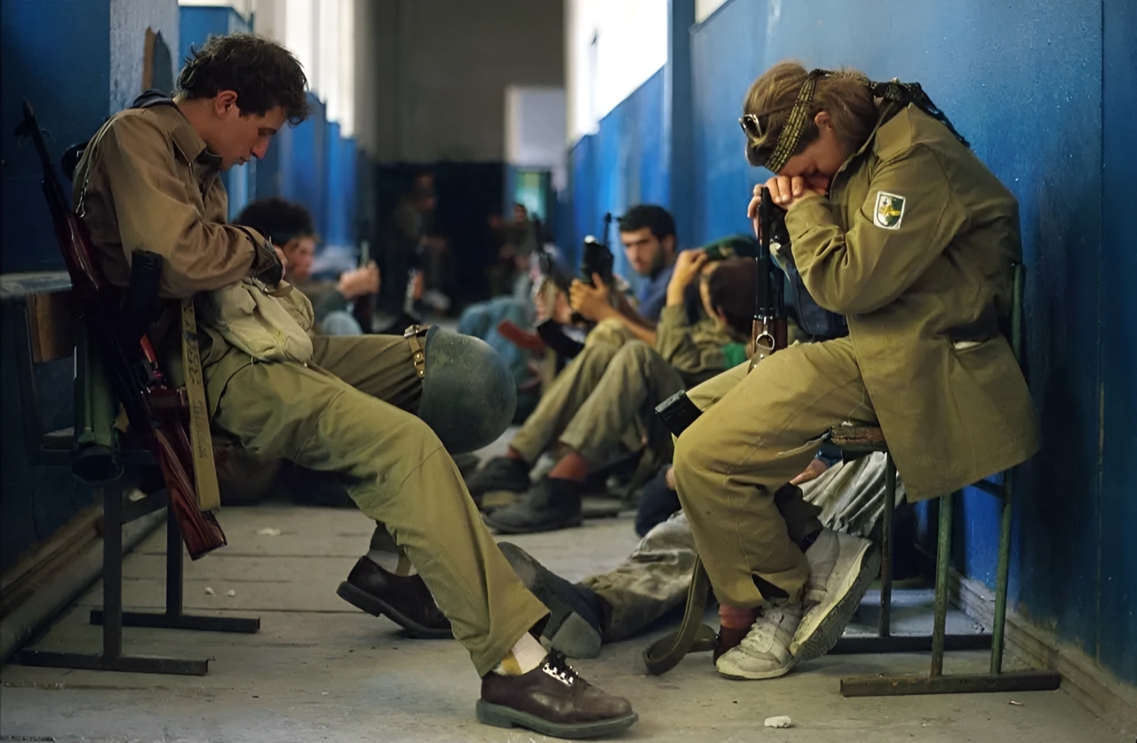 Abkhazian fighters sit in a hallway. September, 1993. © Malcolm Linton.